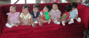 babies sitting on couch